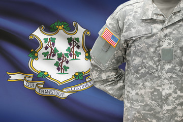 American soldier with US state flag on background - Connecticut