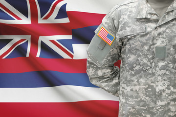 American soldier with US state flag on background - Hawaii