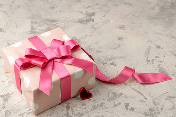 Pink gift boxes and hearts close up on a light concrete background. Valentine's Day. space for text