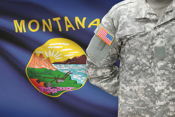 American soldier with US state flag on background - Montana
