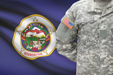 American soldier with US state flag on background - Minnesota