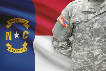 American soldier with US state flag on background - North Carolina