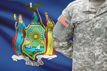 American soldier with US state flag on background - New York