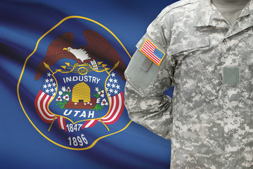 American soldier with US state flag on background - Utah