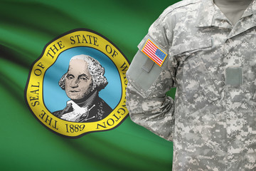 American soldier with US state flag on background - Washington