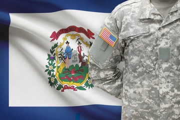 American soldier with US state flag on background - West Virginia