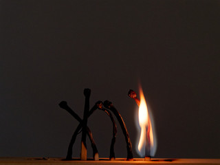 matches sulfur burn with a red flame on a dark background