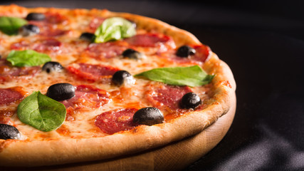 italian pizza with olives and salami