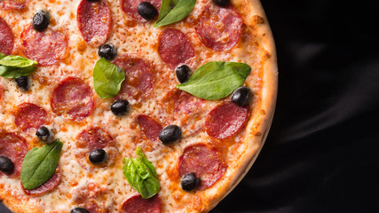 italian pizza with olives and salami