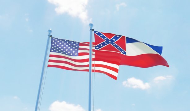 USA and state Mississippi, two flags waving against blue sky. 3d image