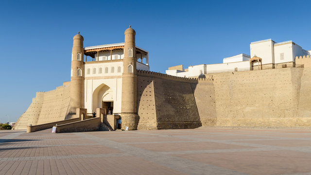 Exterior view of the 5th century Ark Citadel in Bukhara, a UNESCO world heritage site, large earthen fortification.