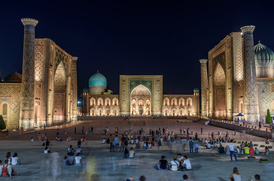 Registan Square at night, with imposing Madrasa buildings, Ulugh Beg Madrasah, Sher-Dor Madrasah and the Tilya Kori Madrasah, Samarkand. 