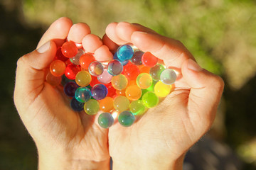 nice background of different colors balls in hands