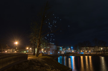 Fototapeta premium Night landscape by the lake with lanterns