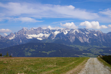 Fototapeta na wymiar View from summit of mountain Gasselhoehe to mountain range Dachstein in Styria - Austria
