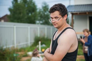 handsome young man in front of his house