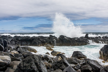 Beautiful splash from a broken on the volcanic rocks waves, Portugal, Atlantic Ocean