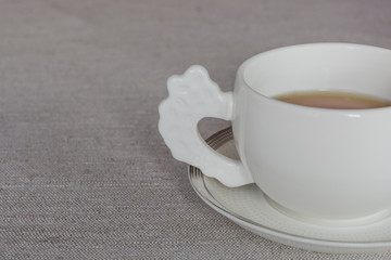 Side close up view of half a tea white cup. Copy space