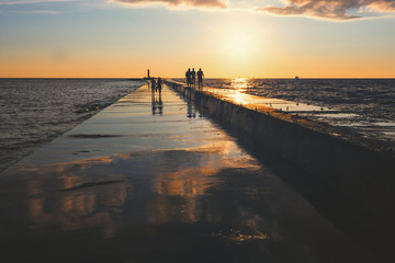 River mouth with lighthouse at sunset