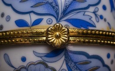 Golden iron flower close-up on a background of blue patterns