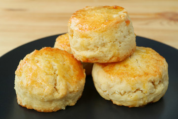 Closed Up Many of Mouthwatering Candied Orange Peel Scones on Black Plate 