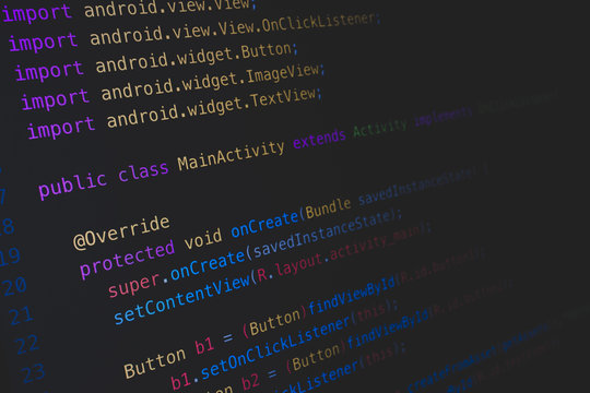 Screen of android application developing code on dark background