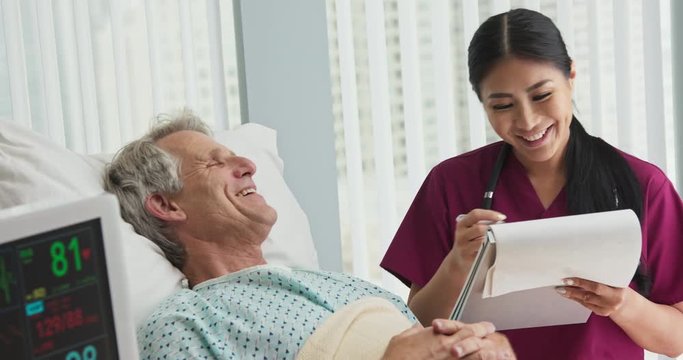 Happy patient recovering in bed after successful operation