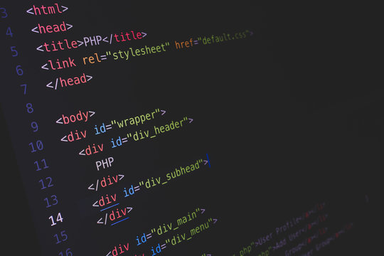 Screen of developing php and HTML code on dark background