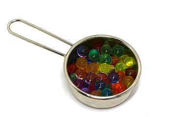 watermelon, plate with colored candy balls on white background, isolated