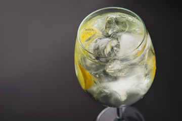 Fresh alcoholic drink with lemon and ice