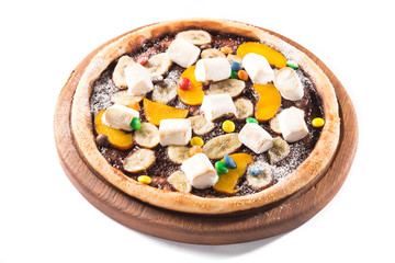 Sweet dessert pizza with chocolate, colored candy