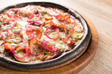 Cuttlefish pizza dough with salami