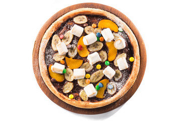 Sweet dessert pizza with chocolate, colored candy