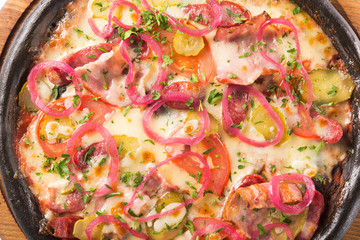 Cuttlefish pizza dough with salami