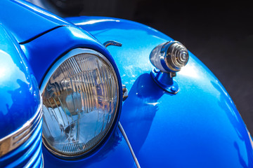 Vintage car. Headlight close up. Vintage car show.