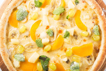 sweet pizza with banana, grapes and mint