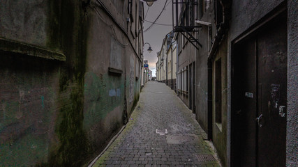 Old alleyway leading to light