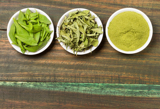 Natural sweetener in powder from stevia plant - Stevia rebaudiana. Top view