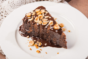 tasty chocolate cake slice with nuts