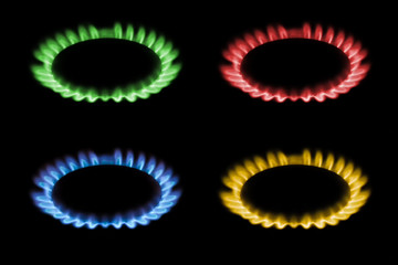 gas burns with red, blue, yellow, green flame on a black background, a collage and three different-colored burning gas
