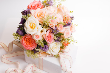 Luxury bouquet made of red roses in flower shop and white ribbon on wooden board. Overhead top view, flat lay. Copy space. Birthday, Mother's, Valentines, Women's, Wedding Day concept