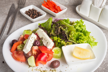 Fresh greek salad with feta cheese and olives