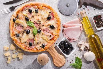 Hot pizza with ham meat, black olive and mushrooms