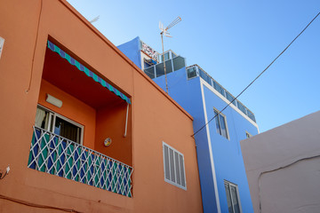 Fototapeta na wymiar Building painted bright colors in Puerto de Santiago, Tenerife, Canary.