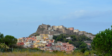 Fototapeta na wymiar Tight view of the hilltop castle of Castelsardo, a coastal historical town in the province of Sassari, in the Italian island of Sardinia
