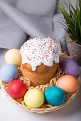 Easter. Traditional Russian and Ukrainian Easter cake (kulich) and painted eggs. Close-up, selective focus.