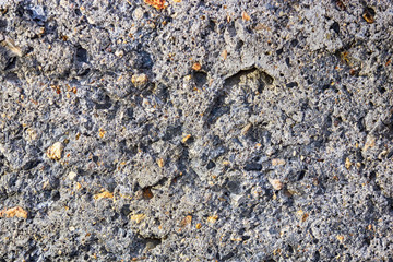 The structure of an artificial gray stone with multi-colored splashes.
