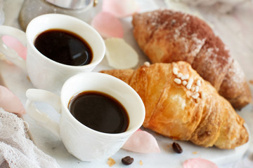 Breakfast with coffee and croissant