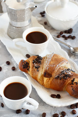 Breakfast with coffee and croissant