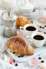 Breakfast with coffee and croissant